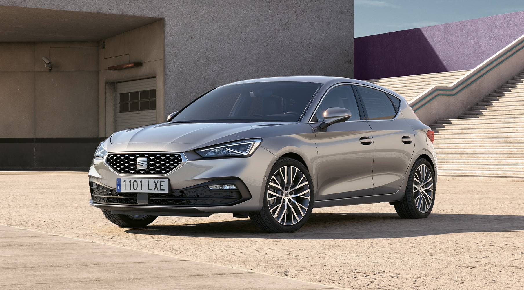 SEAT Leon Sportourer ST parked at home with woman watching in a relaxed scene