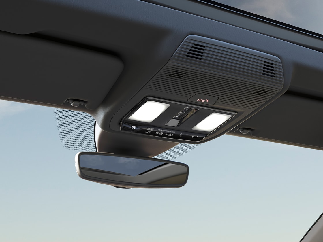 Zbliżenie na przyciski systemu SEAT CONNECT na podsufitce modelu SEAT Leon (wersja 5-drzwiowa).
