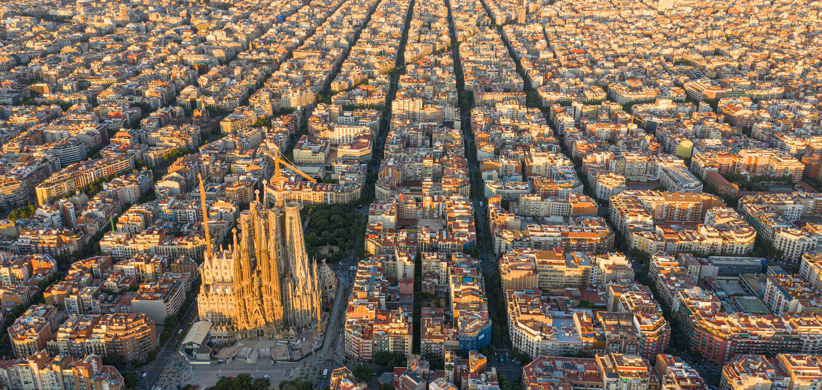Aerial view of Barcelona city with Eixample district and Sagrada Familia cathedral pictured in the centre - SEAT Creative Living