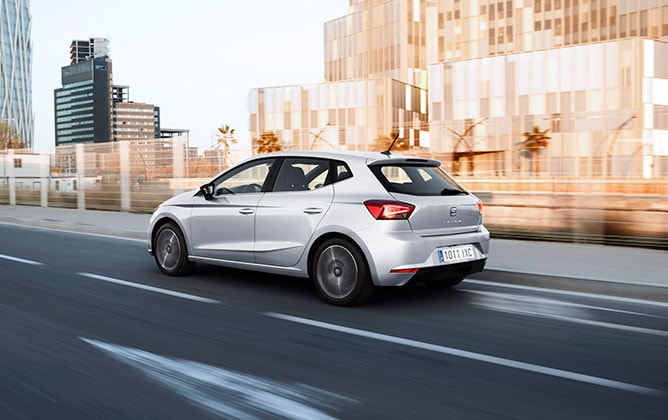 SEAT Ibiza on the road crossing the city